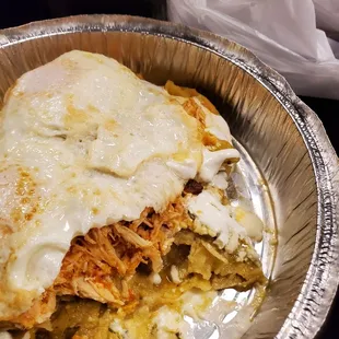 Chilaquiles con huevos - added chicken, no onions. It was great! Huge portion. Lots of flavor and chicken.