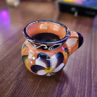 a cup of coffee on a table