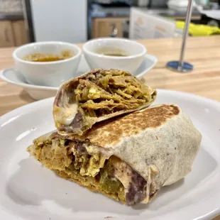 Burrito De Mama (w/ Chorizo) - Expensive but dang it's tasty. I had them put the chilaquiles IN the burrito and it didn't disappoint.