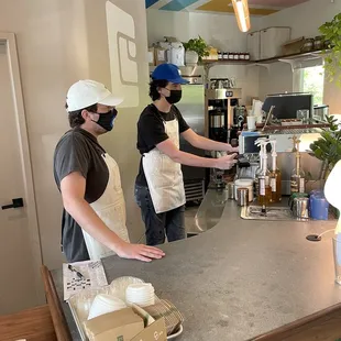 two women preparing food in a kitchen