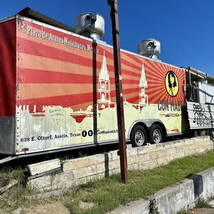 a food truck parked on the side of the road