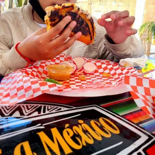 Babygirl ordered a bean and cheese taco.