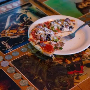 a slice of pizza on a plate