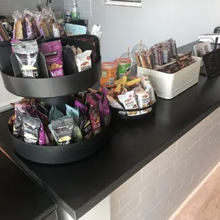 three tiered trays of snacks on a kitchen counter