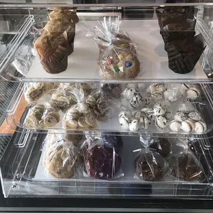 a display case filled with pastries