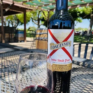 a glass of wine and a bottle