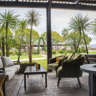 a patio with a fire pit