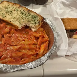 Baked Ziti, garlic bread and Philly Cheese Steak! Couldn&apos;t wait on the garlic bread.