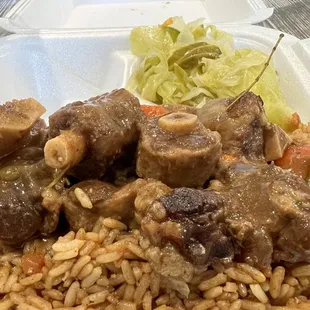 Oxtails, peas and rice, stewed cabbage