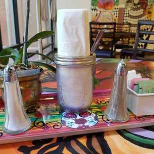 a tray with condiments and salt shakers