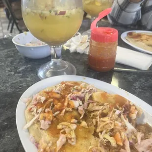 2 pupusas revueltas and fresca de ensalada food is good here but service sucks sometimes it's a hit or a miss