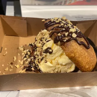 a chocolate covered doughnut in a box