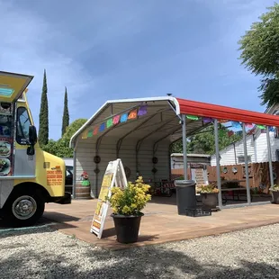 Taco truck with shaded seating area