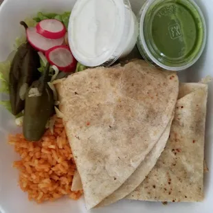 Quesadilla de asada was good and it was not greasy and the portion was fulfilled. The orange rice was good too