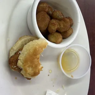 a plate of food and a bowl of dipping sauce
