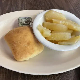 Fried apples and roll.