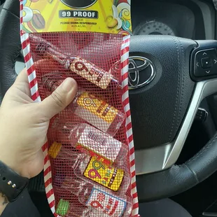 a person holding a bag of candy