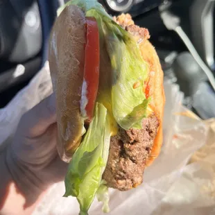 Single cheeseburger with ketchup, mustard, lettuce, Mayo, and tomato