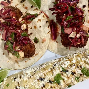 Fish taco special: panko-crusted cod with chipotle-lime crema; cabbage, onion, radish, cilantro, mango slaw served with grilled elote.