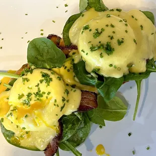 Mother's Day special eggs Benedict with super thick applewood smoked bacon and fresh spinach.