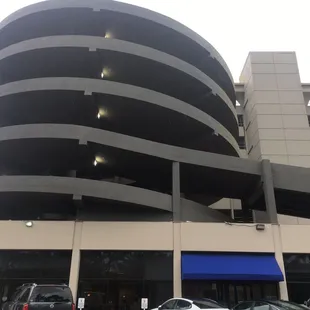 Park at the north end of the Clarke Tower where you see this spiral garage. The entrance is under the blue awning.