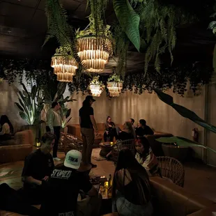 a group of people sitting in a restaurant