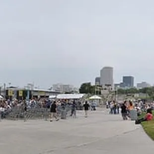 a crowd of people sitting on the grass