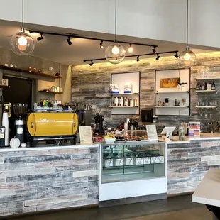 a coffee shop counter with a coffee machine