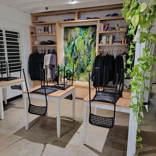 two tables with chairs in front of them