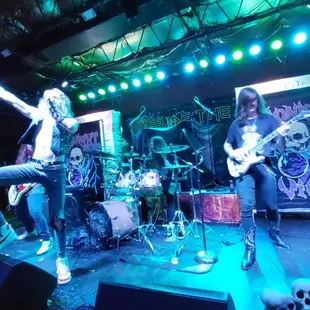 a band playing on stage at night