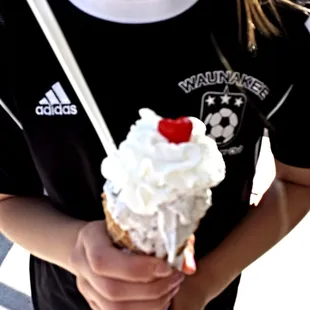 The Cone Zone gives you the option of topping your cone with whipped cream and a cherry.  Yes please.