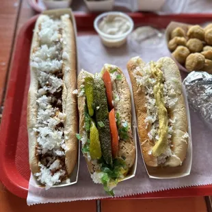a tray of hotdogs and fries