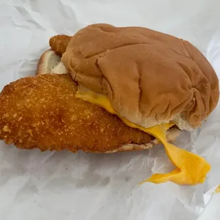 Fish Sandwich minus lettuce added American Cheese.