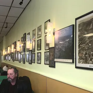 Wall of pictures inside Coney Island.