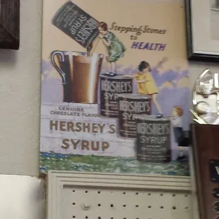 Healthy Hershey's syrup ad on wall.
