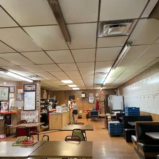 a classroom with tables and chairs