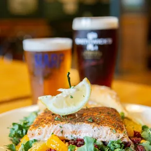 a plate of food and a pint of beer