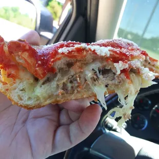 Layers of deep dish done right - cheese sausage cheese sauce romano...
