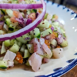 a salad with onions and cucumbers