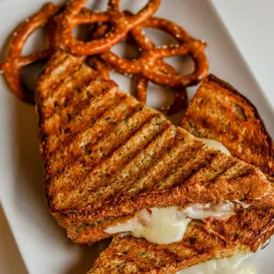 a grilled cheese sandwich with pretzels