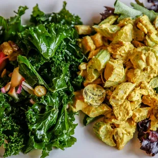 a plate of salad and salad dressing