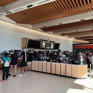 people standing in line at the counter