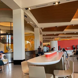 people sitting at tables in a restaurant