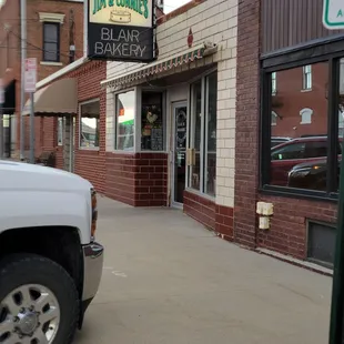 a truck parked in front of a bakery