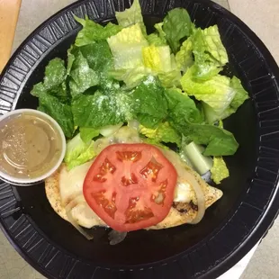 a plate of salad and dressing