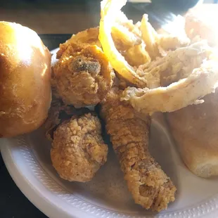 Crispy fried chicken legs, nice dinner rolls, some very yummy onion rings.