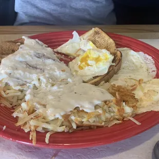 Chicken fried steak with ver easy eggs.
