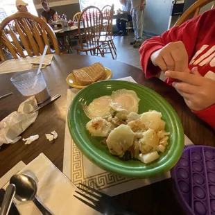 Eggs over easy and potatoes