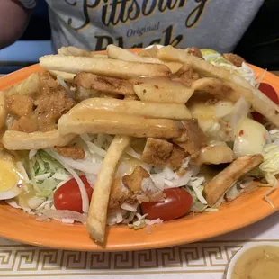 Salad with fried chicken breast on top