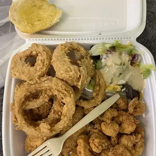 Fish and shrimp box with onion rings and salad and complementary garlic bread